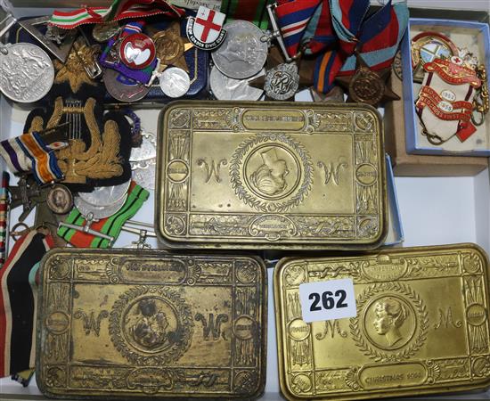 A collection Military tobacco tins, medals, etc.